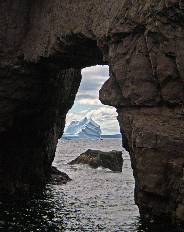 The sea arch at nearby Tickle Cove is always a beautiful sight, but especially when you can spot a massive iceberg through it!